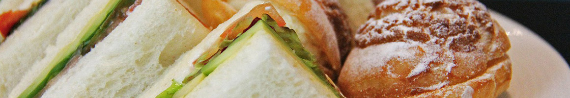 Eating Sandwich at Belle's Cafe restaurant in Williston, VT.